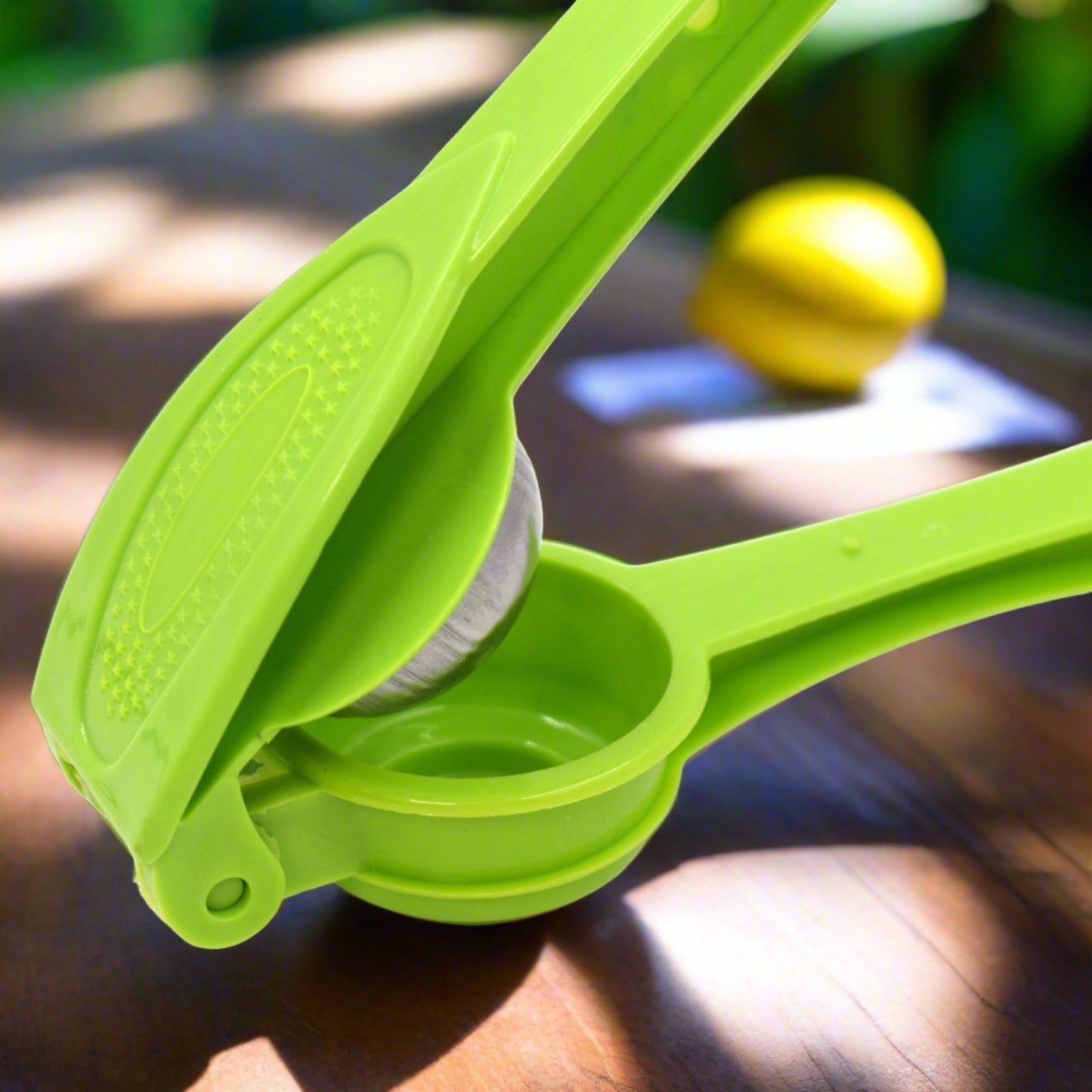 Practical lemon squeezer with built-in opener Practical lemon squeezer with built-in opener